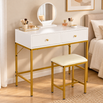 White and gold dressing table set styled with makeup in a modern bedroom