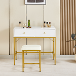 White vanity table and stool with gold frame against a modern feature wall