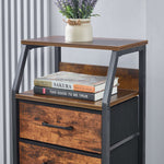 Wooden side table with books and a plant on a plain background
