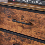 Wooden drawer with a black handle on a wooden surface.
