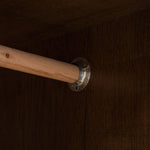 Wooden rod with metal bracket on a brown textured background | Artisansa SA