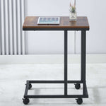 Wooden table with wheels on a white floor| Artisansa SA