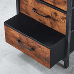 Wooden storage unit with black interior and metal handles on a light gray floor.