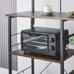 Kitchen Baker's Rack displaying a microwave and coffee cup, showcasing kitchen organization and storage solutions.