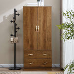 Wooden wardrobe with two doors and three drawers next to a black coat rack with a bag on a beige wall. | Artisansa SA