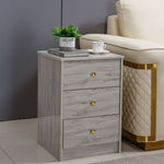 Modern 3-Drawer Side Table BST-01 with grey finish and gold accents beside a cream sofa.