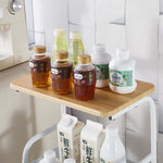 3-Tier Rolling Storage Cart with Wood Top displaying beverages on the wooden surface.