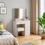 White makeup vanity with mirror, six drawers and stool in a bedroom