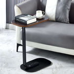 Modern Two-Tone End Table OT-106 placed beside a sofa with a book and a cup on top.