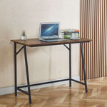 Compact computer desk for students with a laptop on top, ideal for small spaces and home office use.