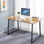 150cm office desk workstation with large desktop, monitor, keyboard, and decorative plant in bright room.