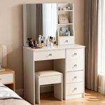 White dressing table with mirror and stool in a neutral bedroom