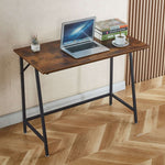 compact computer desk for students with laptop, books, and coffee on wooden surface.