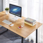 150cm office desk workstation with a computer monitor, keyboard, and books on a wooden surface.