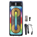 A colorful wireless bluetooth speaker with a microphone, LED lights, and a remote control. The speaker is black with vibrant multicolored lights, and it includes a wired microphone and USB charging cable.