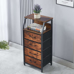 Wooden side table with drawers and a plant on a light gray floor.