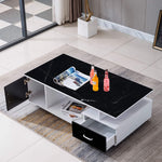 Modern coffee table with black marble top and white base in a living room setting. | Artisansa SA