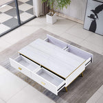 Black and Gold Coffee Table white top variant in a room with a rug and plant - Artisansa