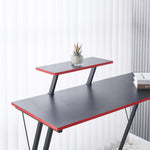 L-Shaped Desk with Monitor Shelf featuring a sleek design and modern aesthetics, showcasing a plant and books.