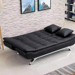 PU leather sleeper couch bed in modern living room with decorative pillows and stylish decor.