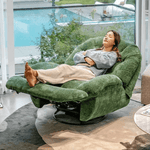 A woman relaxing on a swivel rocker glider couch with phone holder, showcasing comfort and modern design.