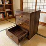 Modern 3-Drawer Nightstand with gold handles and one drawer open, showcasing a minimalist design and warm wood finish.