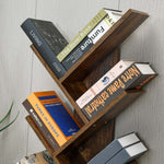 Freestanding Tree Bookshelf with Cabinet displaying books in a stylish, modern design, enhancing home decor.
