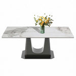 Rectangular marble dining table Q-03 with a stylish black U style leg and a vase of flowers on top.