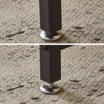 Close-up of adjustable feet on a modern computer desk, ensuring stability on any surface.