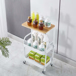 3-Tier Rolling Storage Cart with Wood Top displaying drinks and snacks on a modern white trolley.