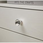 Close-up of a crystal knob on a White Bedside Table with Drawers, showcasing elegant design details.