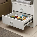 White Bedside Table with Drawers showcasing an open drawer filled with magazines and decorative items.