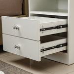 White Bedside Table with Drawers featuring sleek design and crystal knobs, showcasing two open drawers.