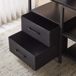 Close-up of black storage drawers in a TV stand with charging station, showcasing smart storage solutions for a neat living room.