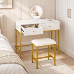 White and gold dressing table with one drawer open in a bedroom