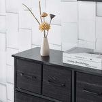 Stylish Fabric 8-Drawer Storage with decorative flowers and books on top, ideal for organized living spaces.