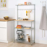 Heavy-Duty Baker's Rack with wood top, featuring storage shelves and kitchen appliances, ideal for organization.