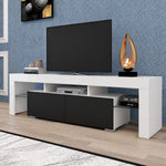 Angled view of white and black TV stand with two drawers and open media storage