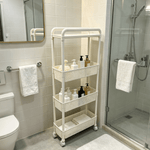 4-Tier Rolling Storage Cart in a modern bathroom, holding toiletries and towels, showcasing practical organization.