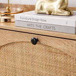 Rattan Flip-Top Shoe Cabinet showcasing rattan texture with decorative books and a golden figurine on top.