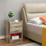 Modern LED Pedestal with Open Shelf beside a stylish bed, featuring two drawers and a decorative plant.