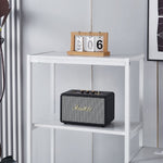 White computer desk shelving unit displaying smart speaker and decor