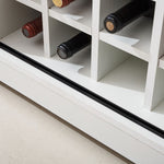 Interior view of Farmhouse Wine Bar Cabinet showcasing wine bottle storage with a rustic white finish.