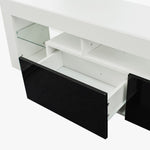Modern Floating LED TV Stand with sleek design and open shelves, showcasing drawers in high-gloss black and white finish.
