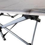 Close-up of reinforced X-frame structure on heavy-duty folding camping cot