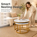 Woman sliding the small white and gold table beneath the larger nesting coffee table