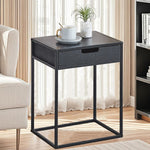 compact bedside table with drawer beside a modern bed for bedroom storage