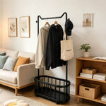 Freestanding Clothes Rack with hoodies and a bag in a stylish living room setting.