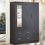 Dark blue wardrobe with gold handles in a room with a couch and plants.