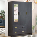 Dark blue wardrobe with gold handles in a room with a couch and plants.